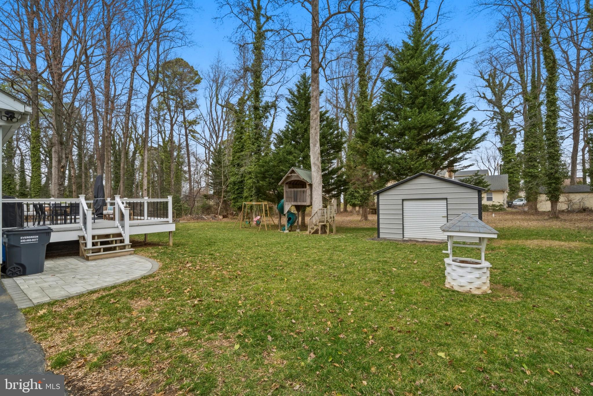 3930 Dogwood Road Port Republic, MD 20676 - Photo 36 of 48 a wooden bench sitting in the middle of a yard