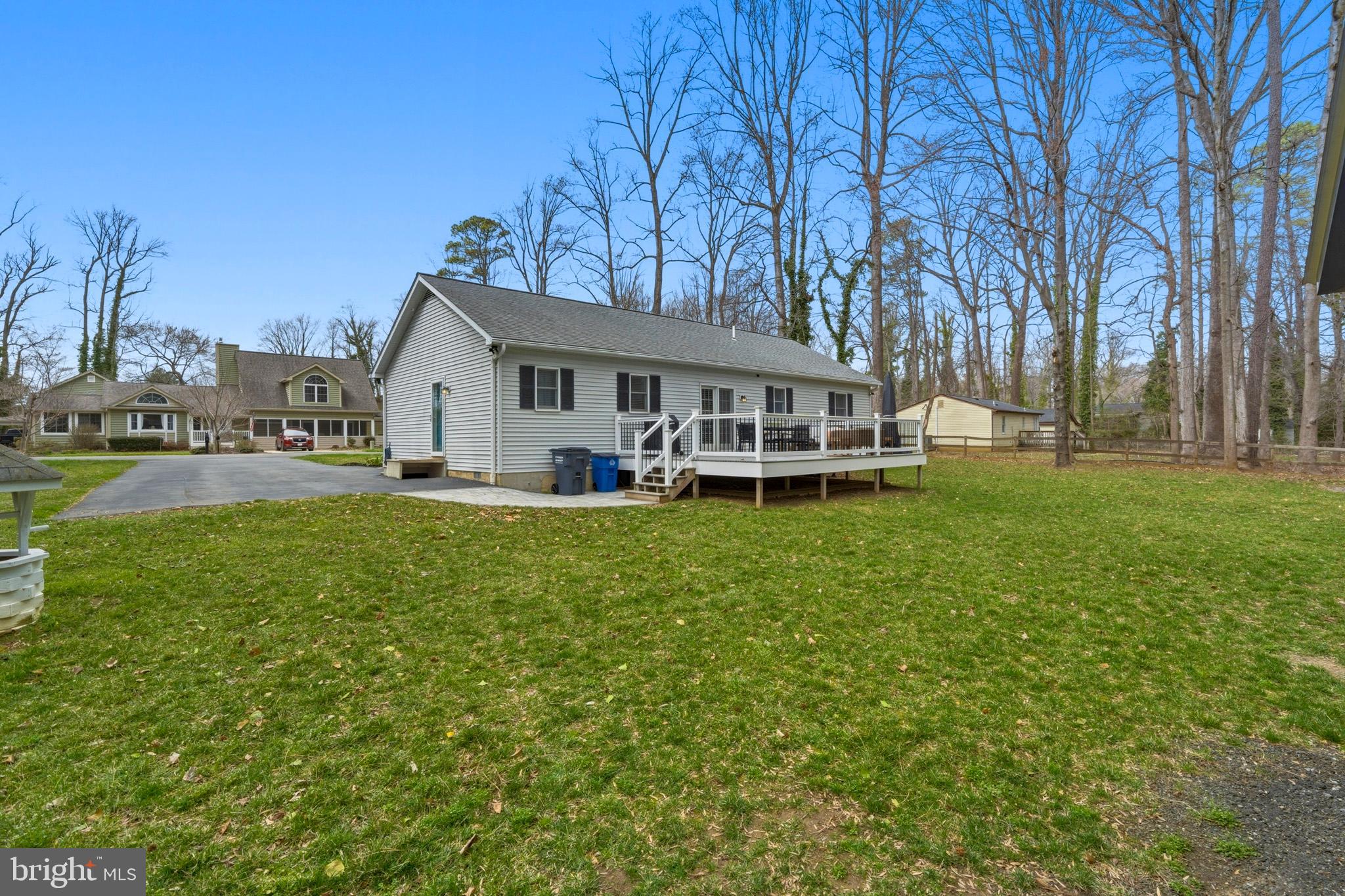 3930 Dogwood Road Port Republic, MD 20676 - Photo 38 of 48 a view of a house with a backyard porch and sitting area