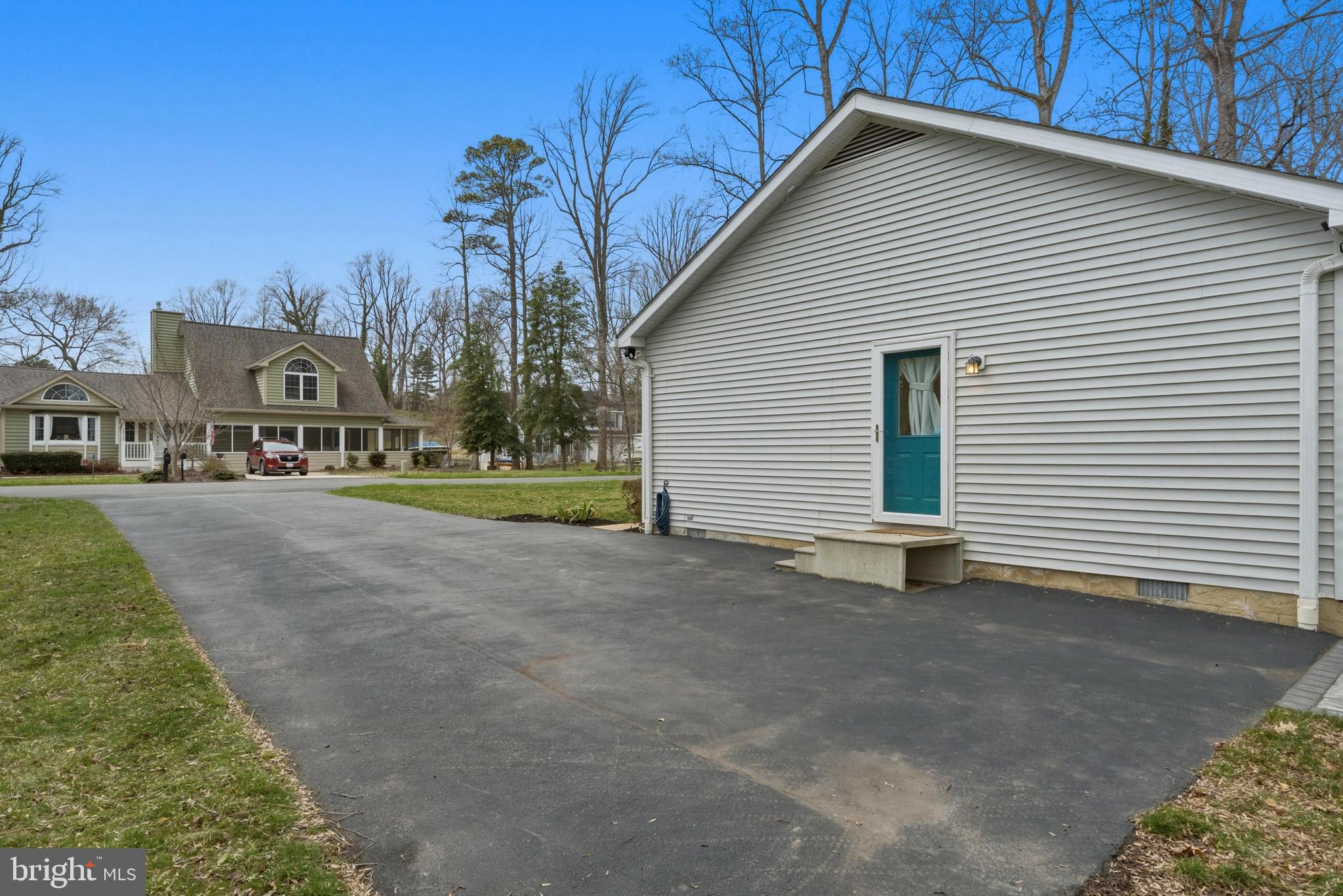 3930 Dogwood Road Port Republic, MD 20676 - Photo 39 of 48 a view of a house with a yard and garage
