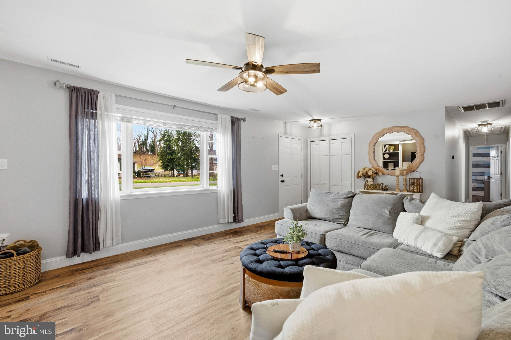 3930 Dogwood Road Port Republic, MD 20676 - Photo 6 of 48 a living room with furniture and a wooden floor