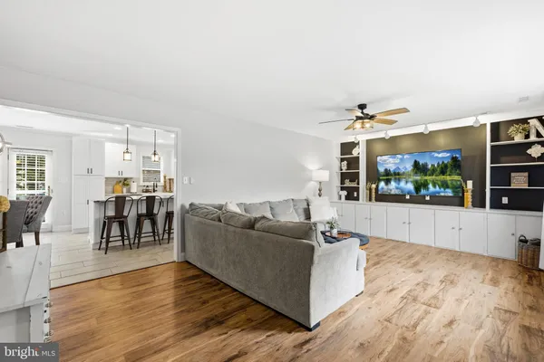 a view of a dining room with furniture wooden floor and chandelier