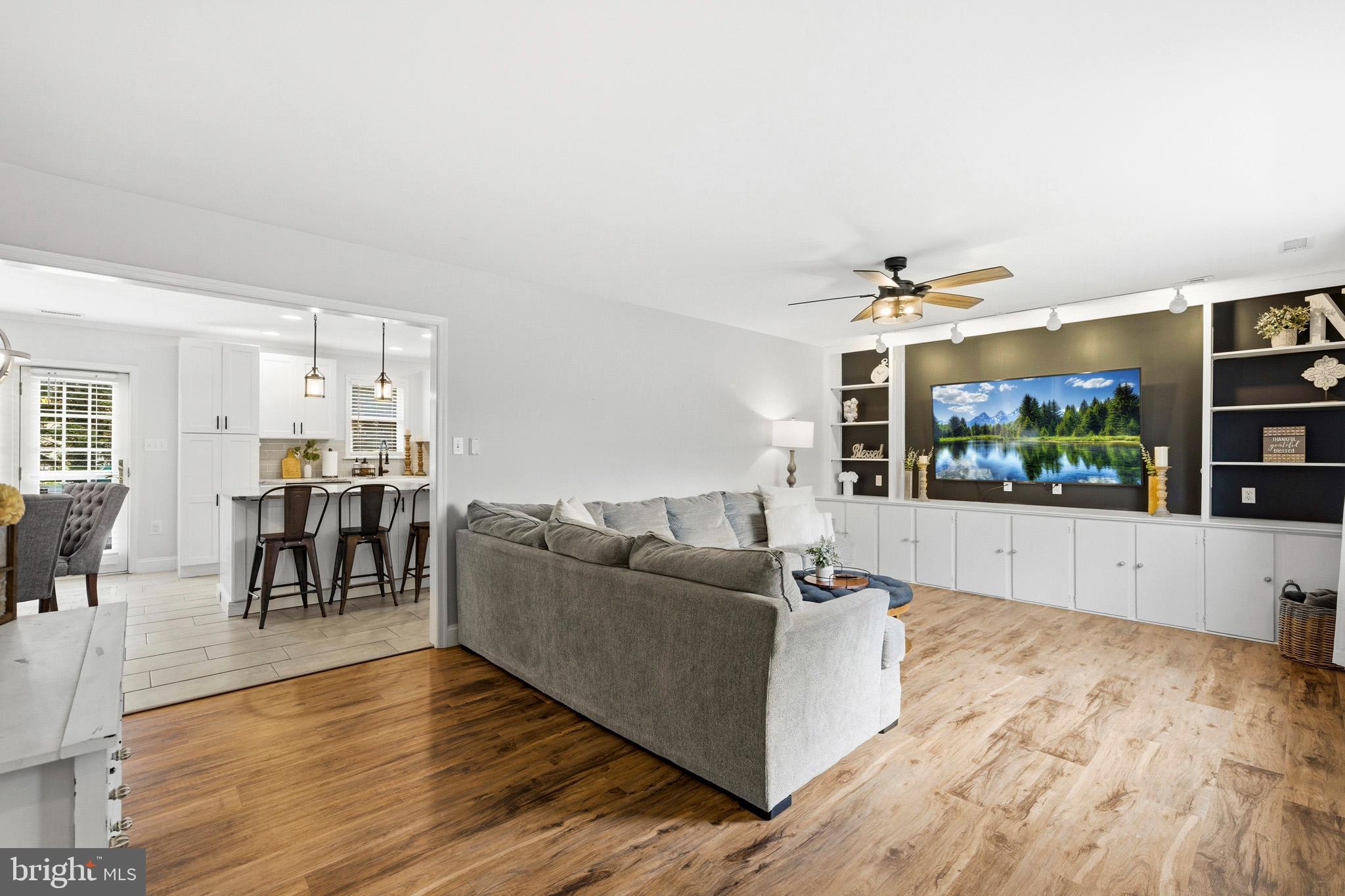 3930 Dogwood Road Port Republic, MD 20676 - Photo 10 of 48 a living room with furniture and a flat screen tv