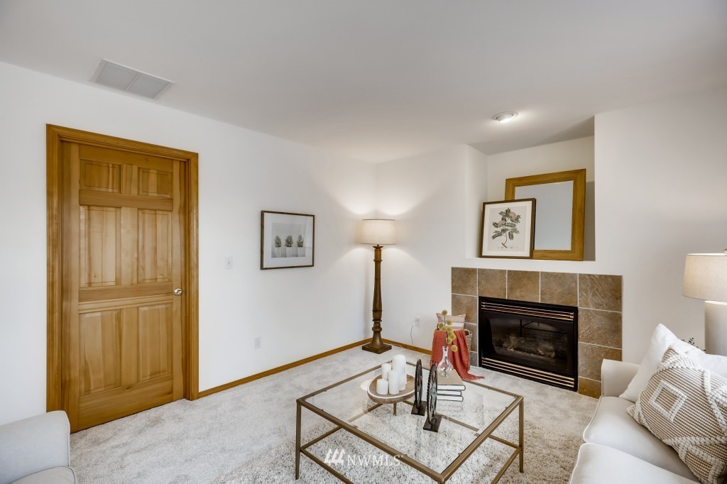 16648 Sylvester Road Southwest Burien, WA 98166 - Photo 13 of 36 a living room with furniture and a fireplace