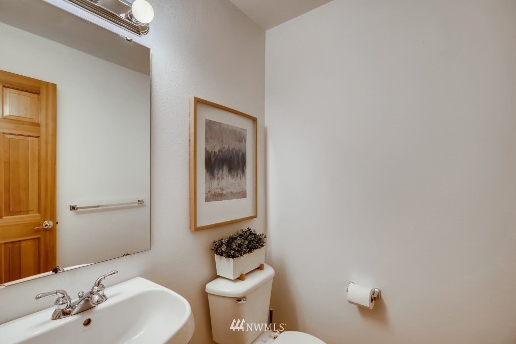 16648 Sylvester Road Southwest Burien, WA 98166 - Photo 15 of 36 a bathroom with a sink mirror and a toilet