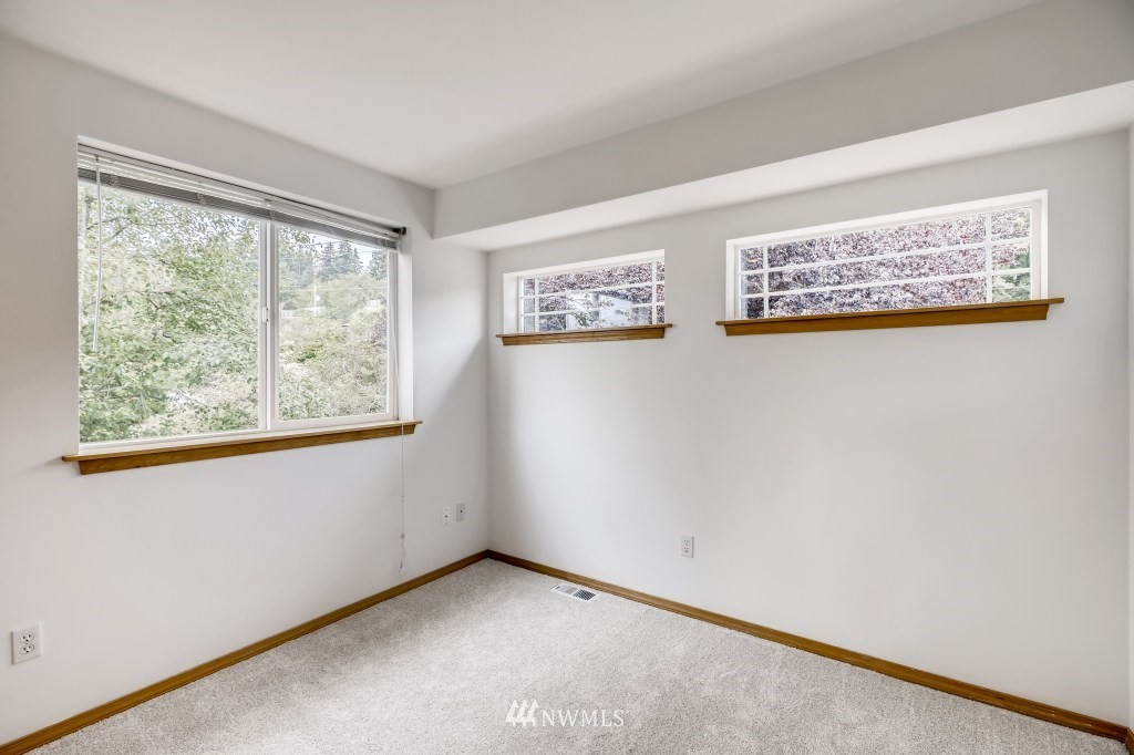 16648 Sylvester Road Southwest Burien, WA 98166 - Photo 22 of 36 an empty room with windows