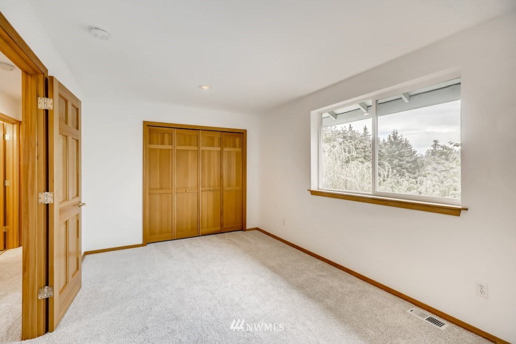 16648 Sylvester Road Southwest Burien, WA 98166 - Photo 23 of 36 a view of an empty room with a window