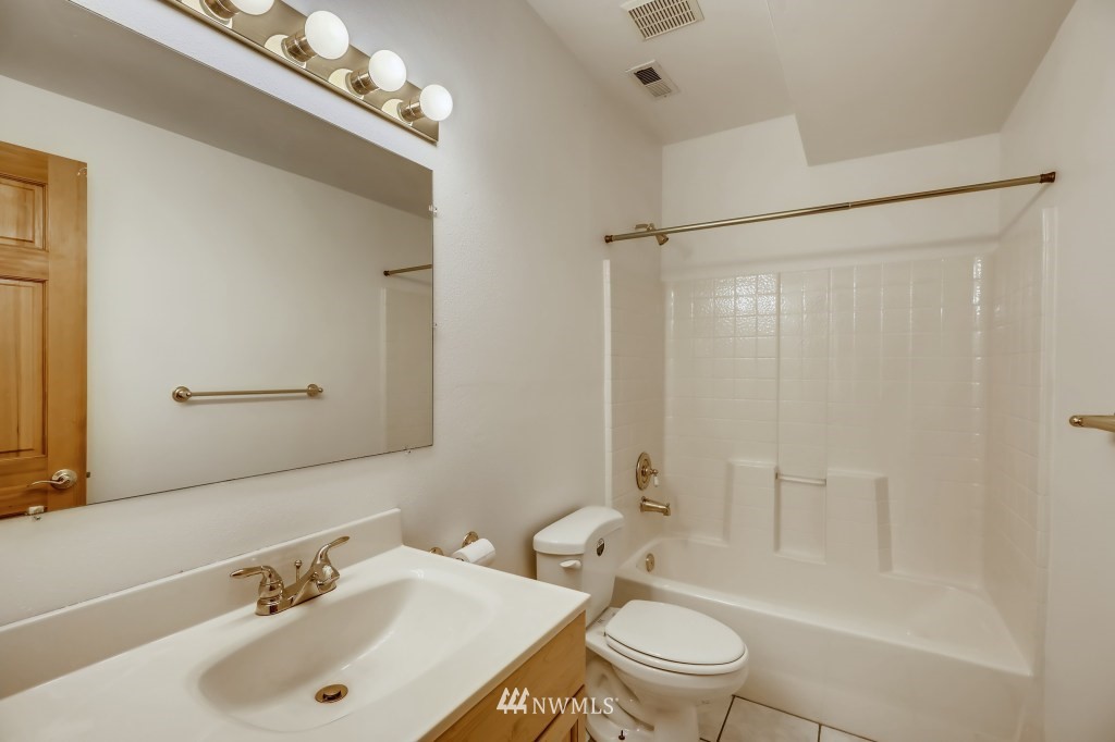 16648 Sylvester Road Southwest Burien, WA 98166 - Photo 30 of 36 a bathroom with a sink a toilet and shower