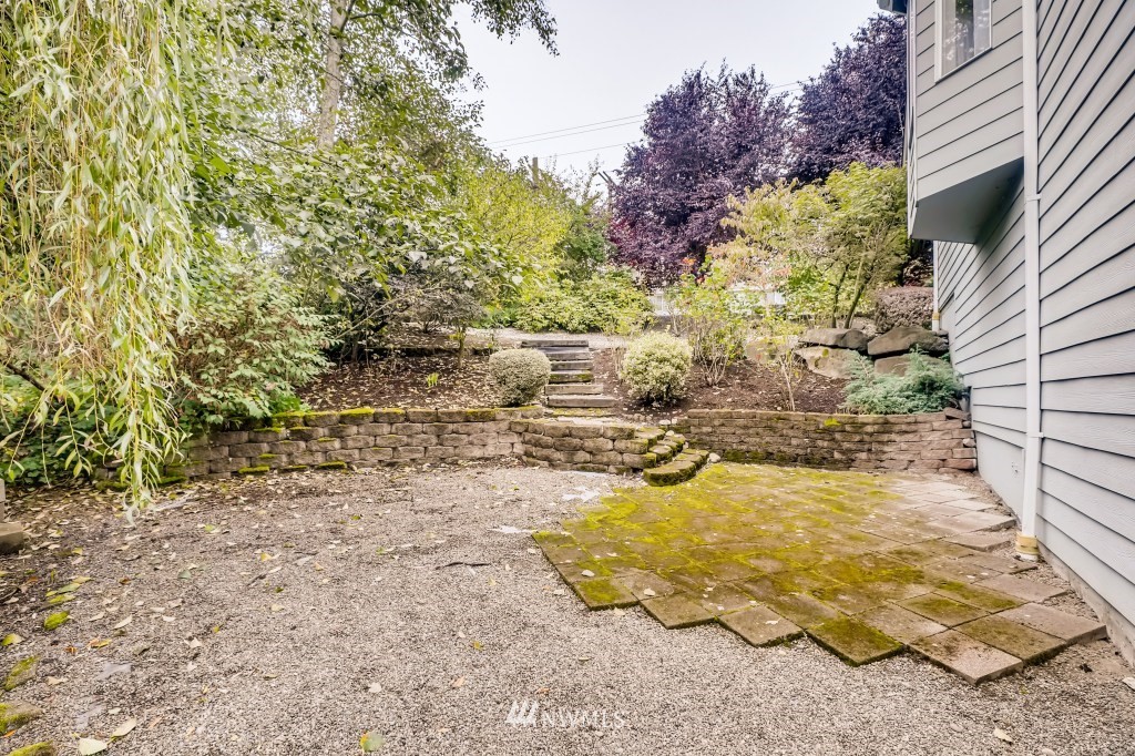 16648 Sylvester Road Southwest Burien, WA 98166 - Photo 35 of 36 a view of a yard with an trees