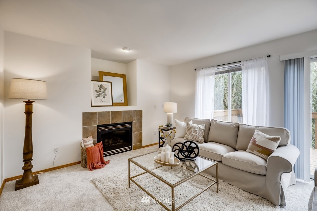 16648 Sylvester Road Southwest Burien, WA 98166 - Photo 10 of 36 a living room with furniture and a fireplace