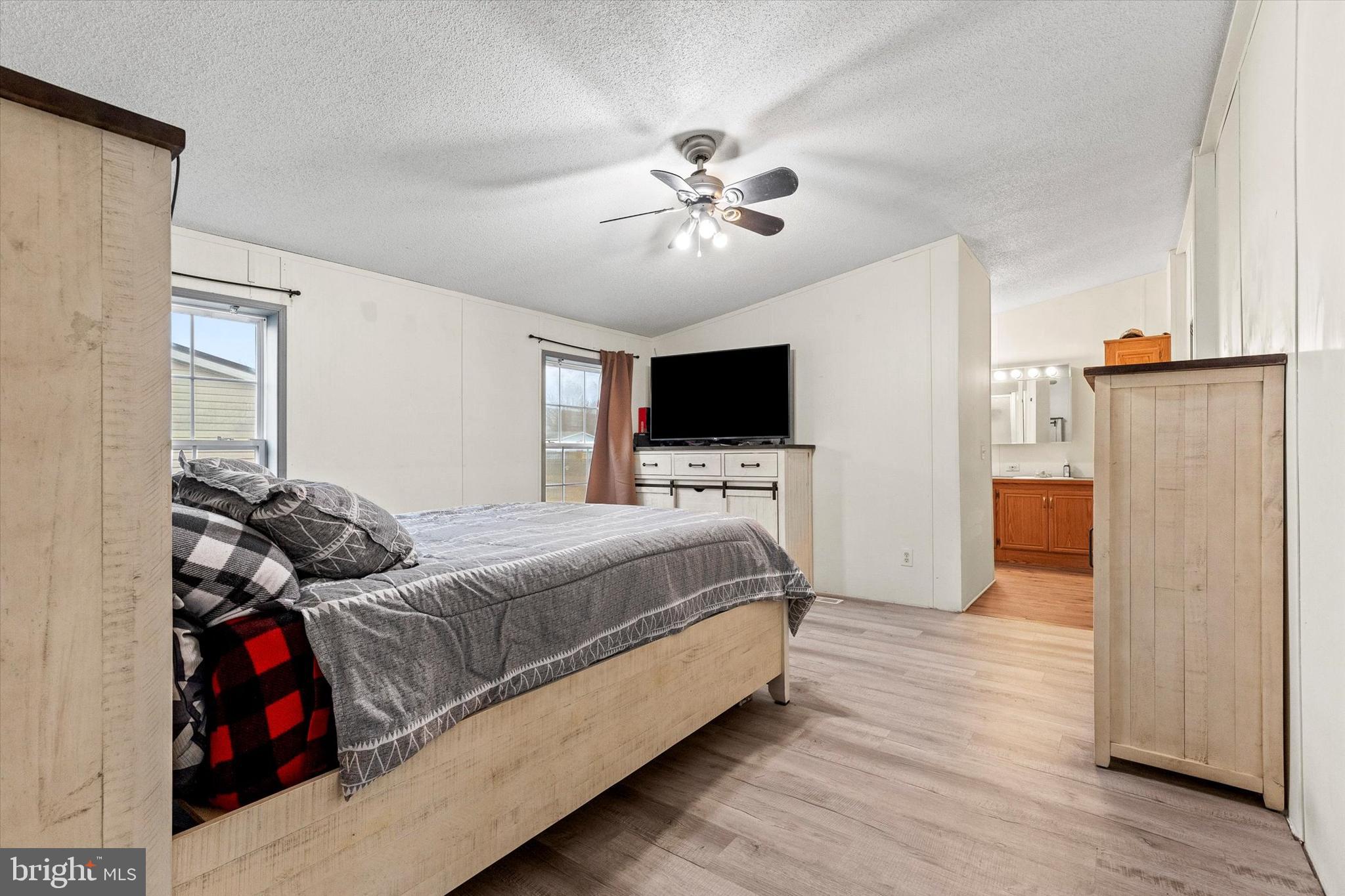 14 Junction Road Millersburg, PA 17061 - Photo 16 of 23 a bedroom with a bed and a flat screen tv