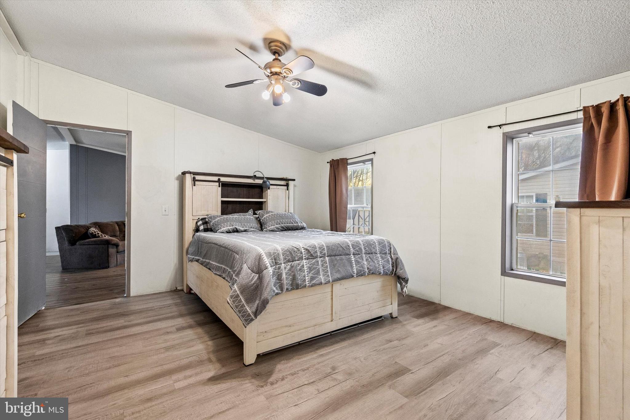 14 Junction Road Millersburg, PA 17061 - Photo 17 of 23 a bedroom with a large bed and a chandelier