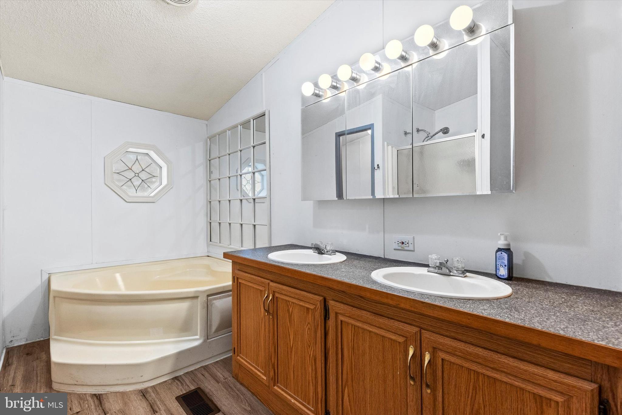 14 Junction Road Millersburg, PA 17061 - Photo 18 of 23 a bathroom with a sink a toilet and a mirror
