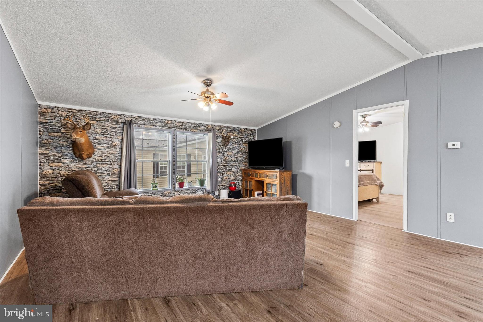 14 Junction Road Millersburg, PA 17061 - Photo 7 of 23 a living room with furniture and a flat screen tv
