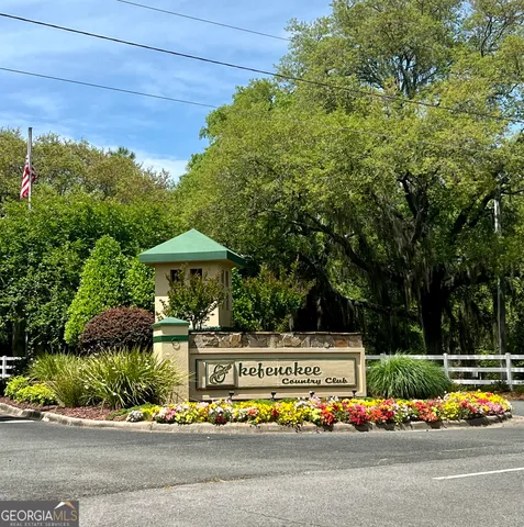 a view of a bench in front of house