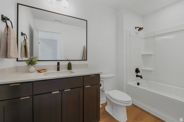 493 East Alice Way Layton, UT 84041 - Photo 18 of 31 Full bath with vanity, light wood finished floors, and shower / bath combination
