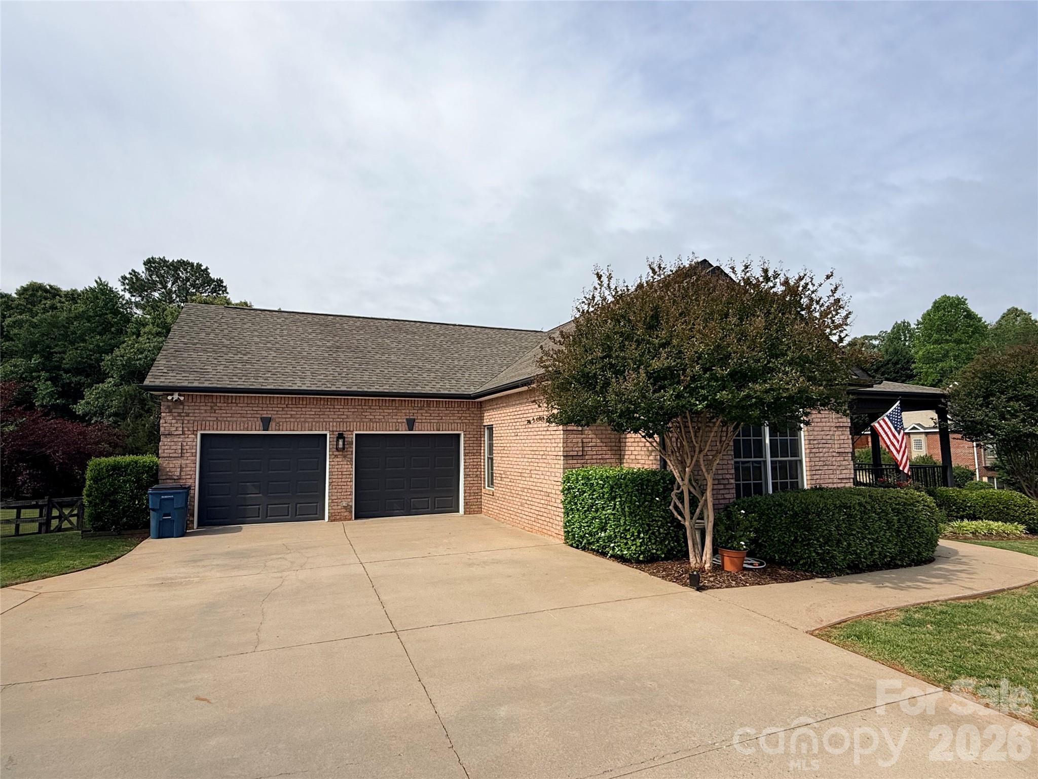 183 Burl Bridges Road Forest City, NC 28043 - Photo 5 of 33 a front view of a house with a yard and garage