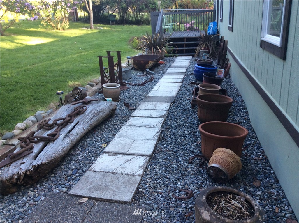 3506 East Harbor Road Langley, WA 98260 - Photo 3 of 15 a view of a backyard with sitting area