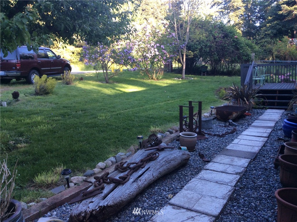 3506 East Harbor Road Langley, WA 98260 - Photo 4 of 15 a view of backyard with seating area and green space