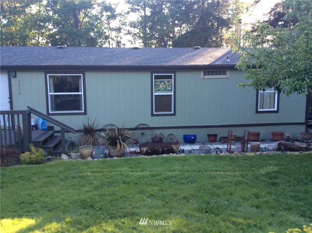 3506 East Harbor Road Langley, WA 98260 - Photo 5 of 15 a front view of house with yard and seating