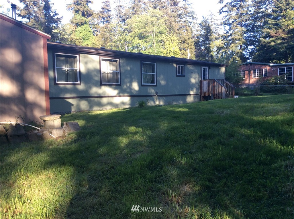 3506 East Harbor Road Langley, WA 98260 - Photo 8 of 15 a front view of a house with garden