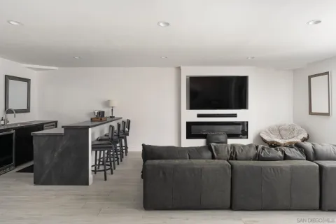 a spacious bedroom with a bed and a lamp