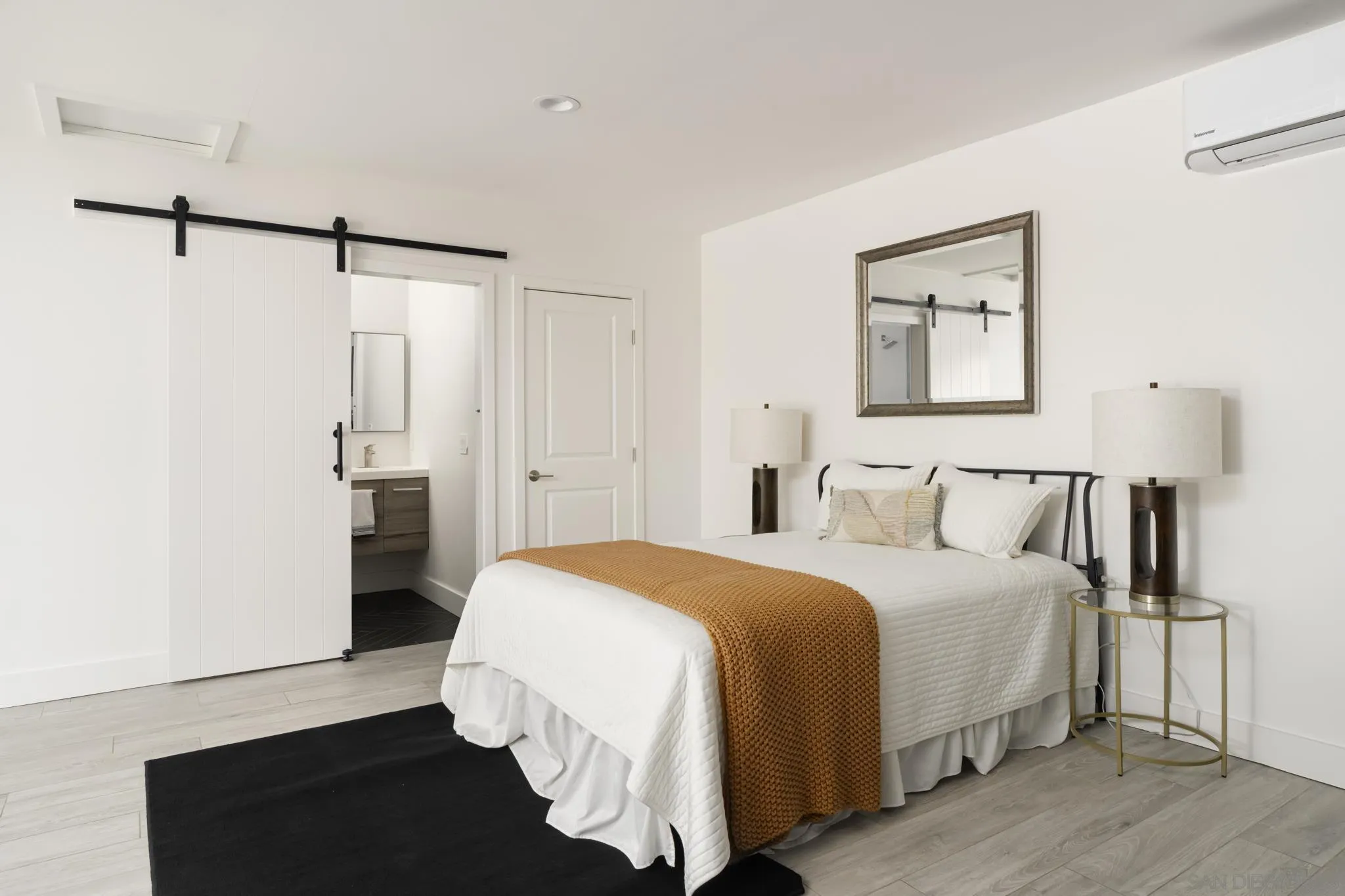 15102 Sun Valley Lane Del Mar, CA 92014 - Photo 20 of 45 a bedroom with a bed and a night stand