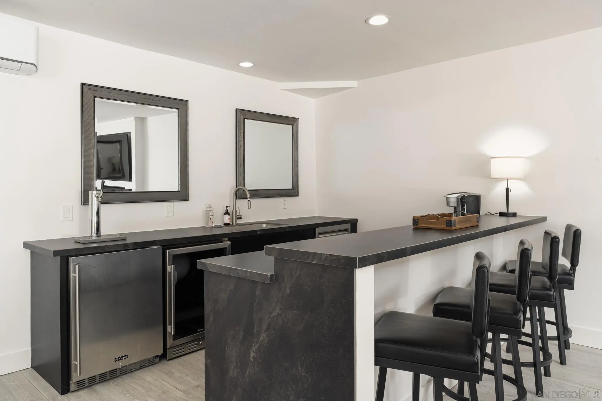 15102 Sun Valley Lane Del Mar, CA 92014 - Photo 21 of 45 a kitchen with granite countertop a sink and chairs