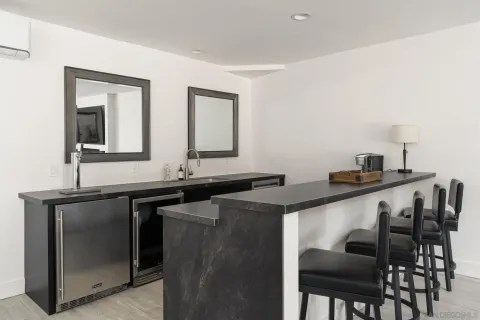 a front view of a house with a garden and yard