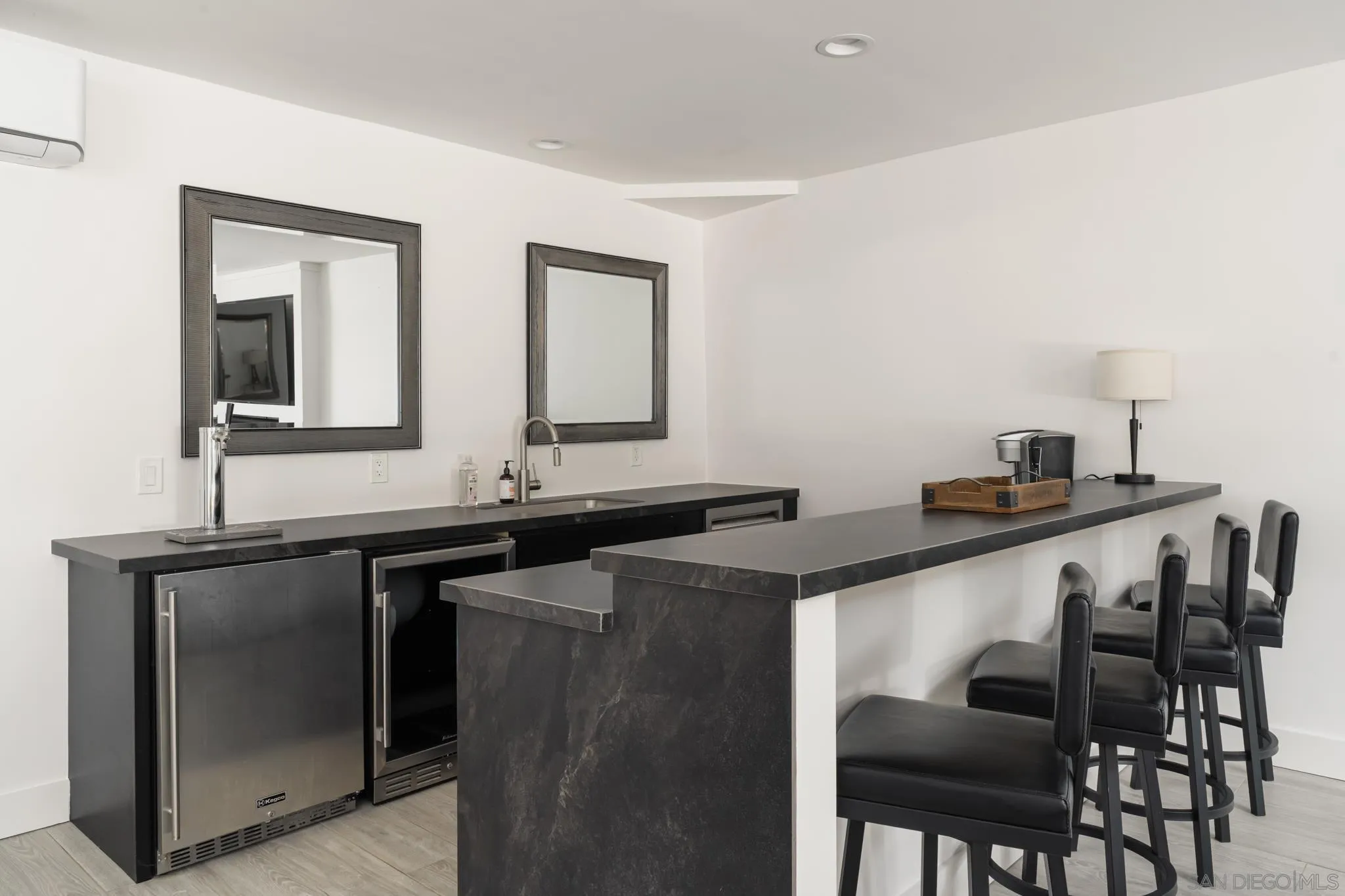 15102 Sun Valley Lane Del Mar, CA 92014 - Photo 22 of 45 a kitchen with granite countertop a sink and chairs