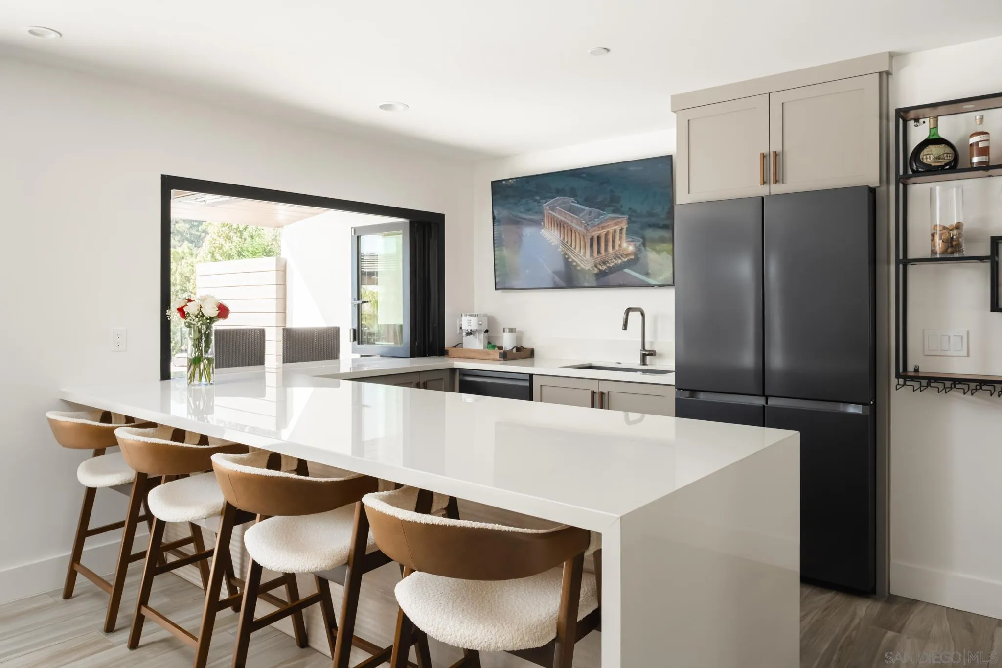 15102 Sun Valley Lane Del Mar, CA 92014 - Photo 29 of 45 a large kitchen with a table and chairs