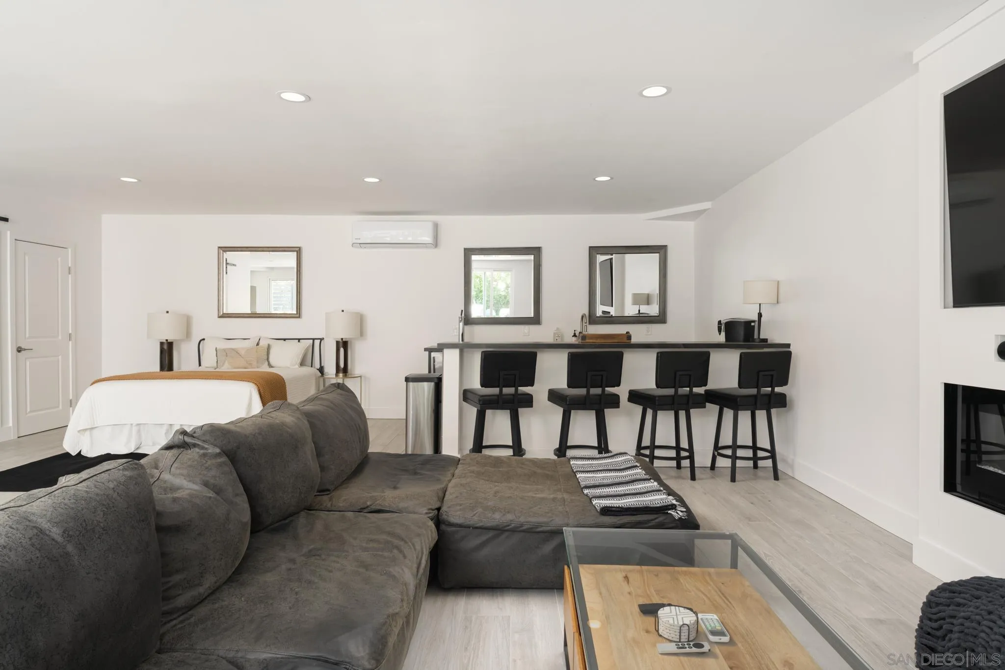 15102 Sun Valley Lane Del Mar, CA 92014 - Photo 32 of 45 a living room with furniture and a dining table with potted plant