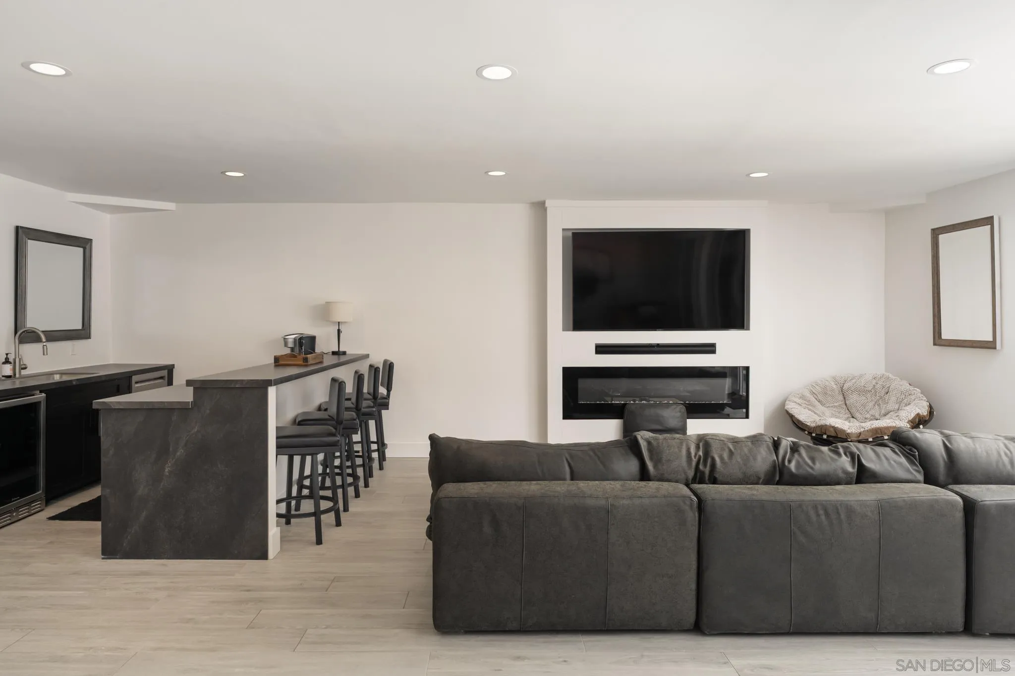 15102 Sun Valley Lane Del Mar, CA 92014 - Photo 34 of 45 a living room with furniture and a flat screen tv