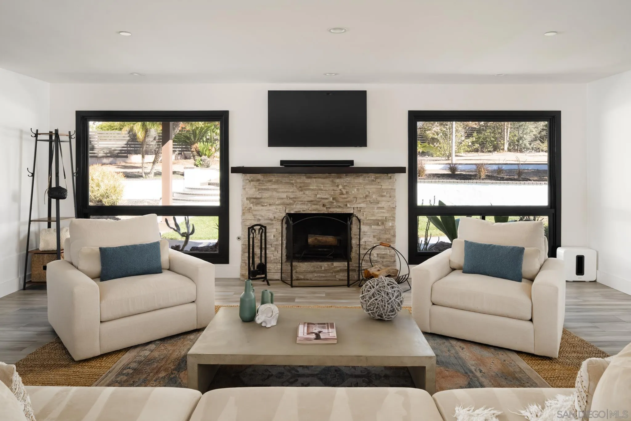 15102 Sun Valley Lane Del Mar, CA 92014 - Photo 39 of 45 a living room with furniture and a fireplace