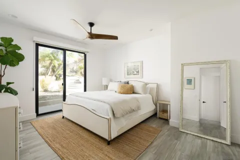 a bed room with a bed and a window