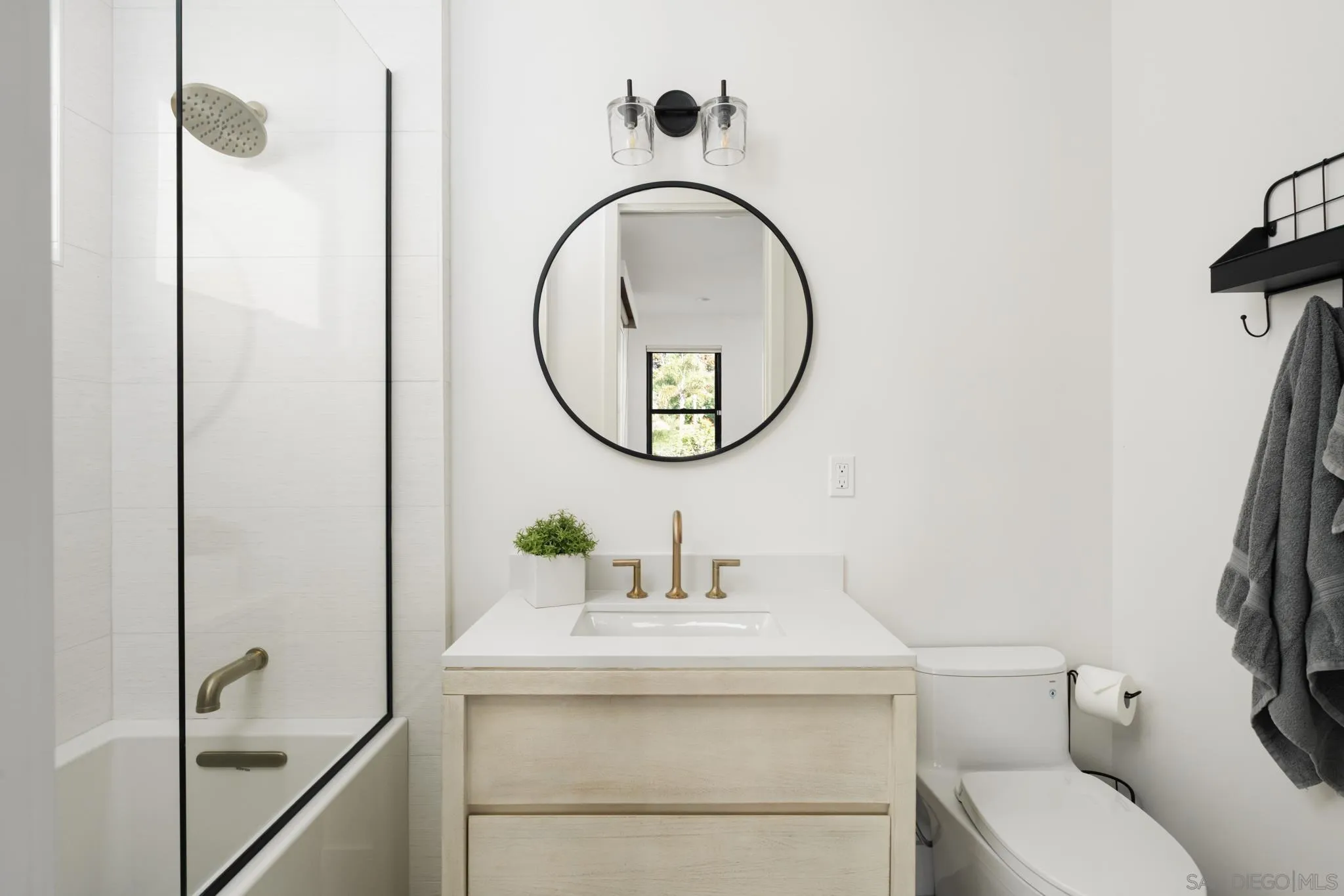 15102 Sun Valley Lane Del Mar, CA 92014 - Photo 43 of 45 a bathroom with a sink toilet and a mirror