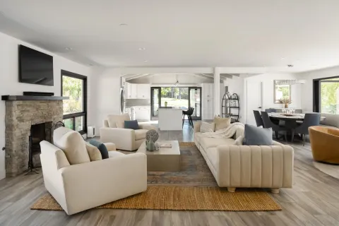 a living room with furniture fireplace and flat screen tv