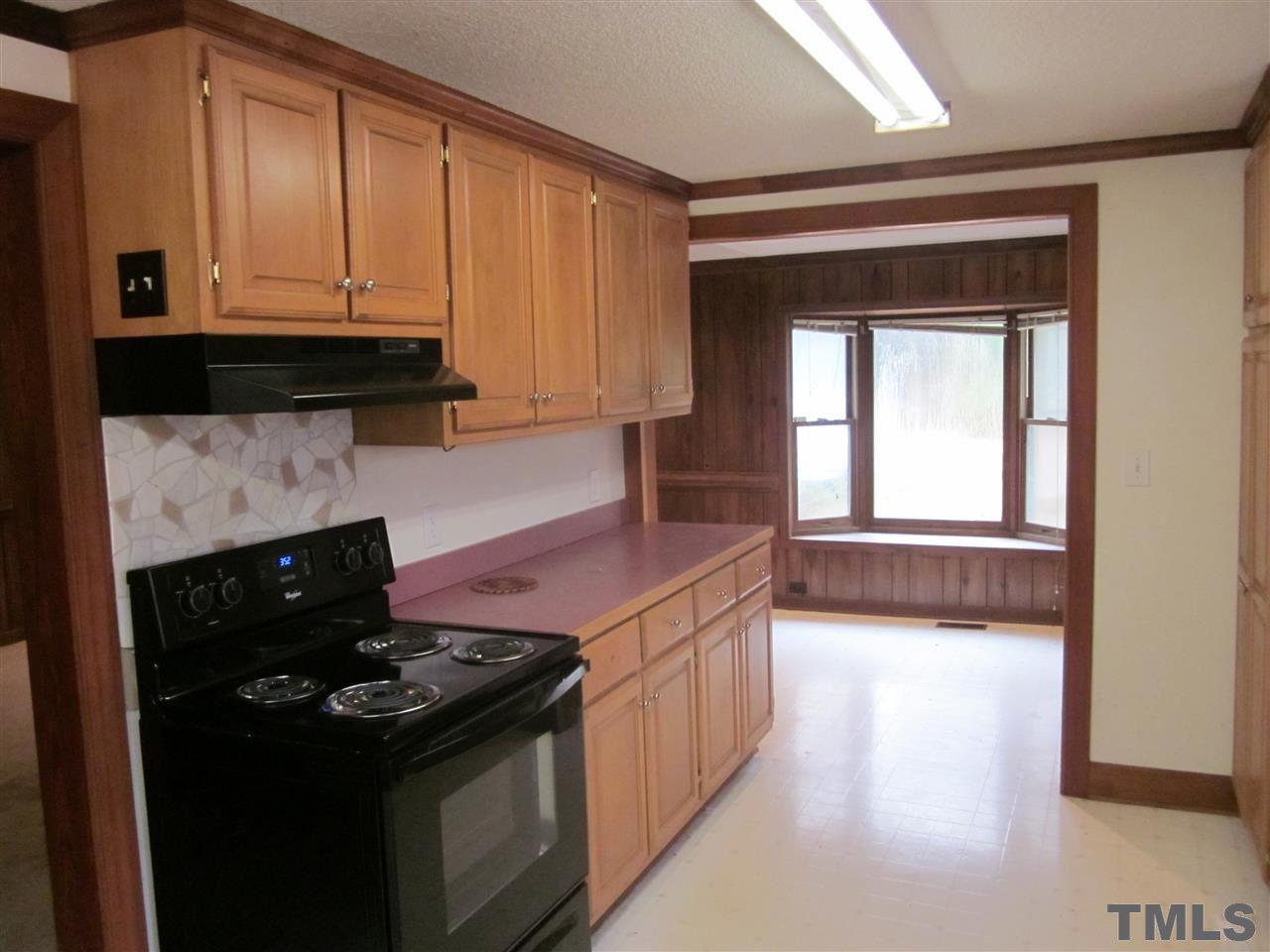 4720 Green Riley Road Rougemont, NC 27572 - Photo 4 of 8 a kitchen with a stove and a microwave
