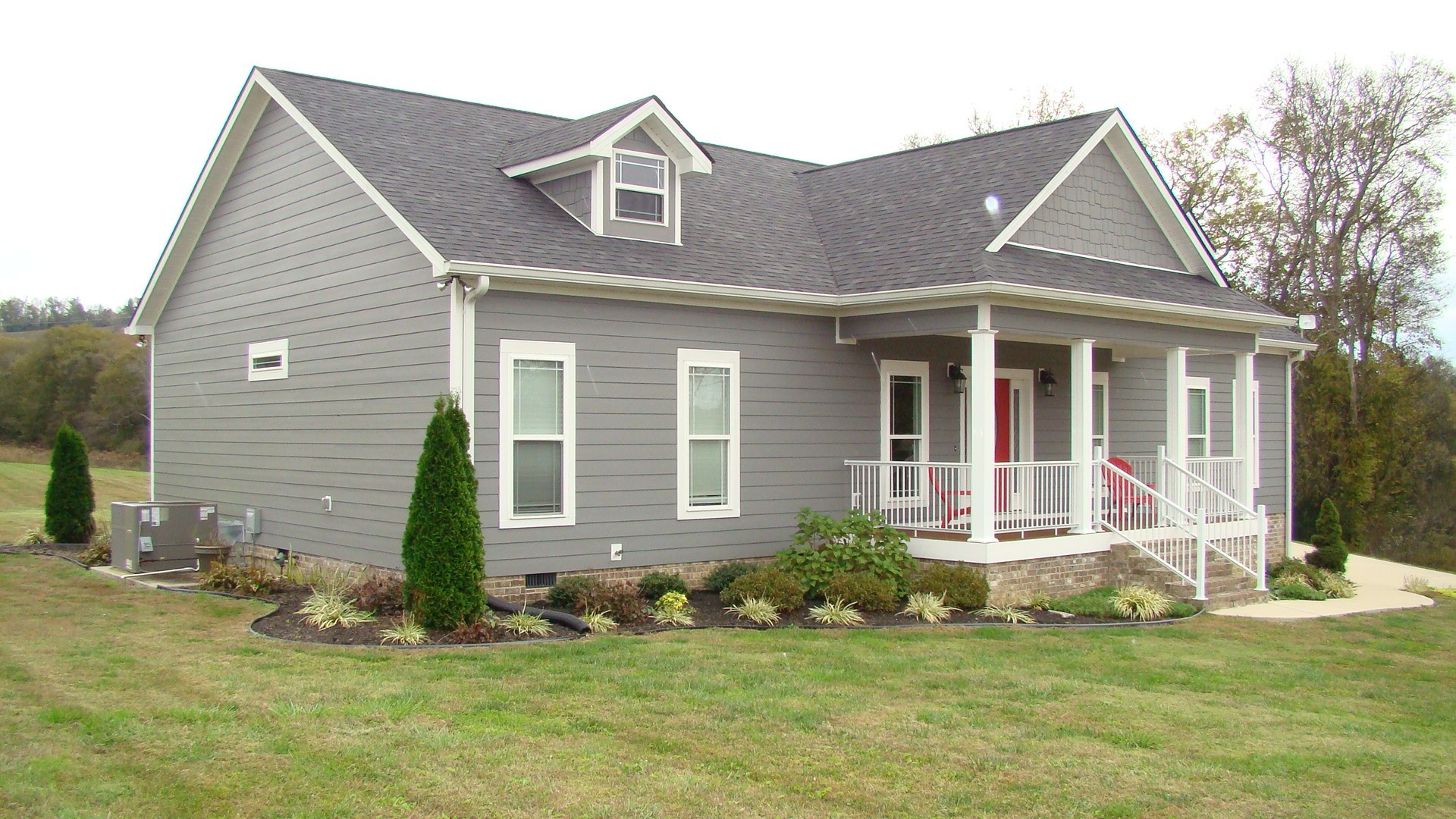 370 Red Hill Road Normandy, TN 37360 - Photo 3 of 38 a front view of a house with a yard