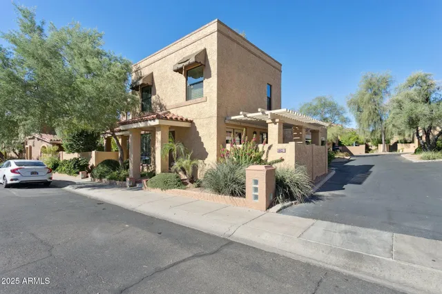 a view of a car park in front of house