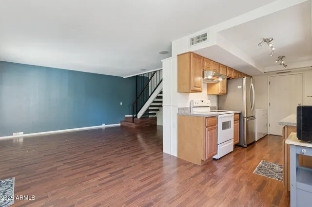 a view of kitchen with furniture and wooden floor