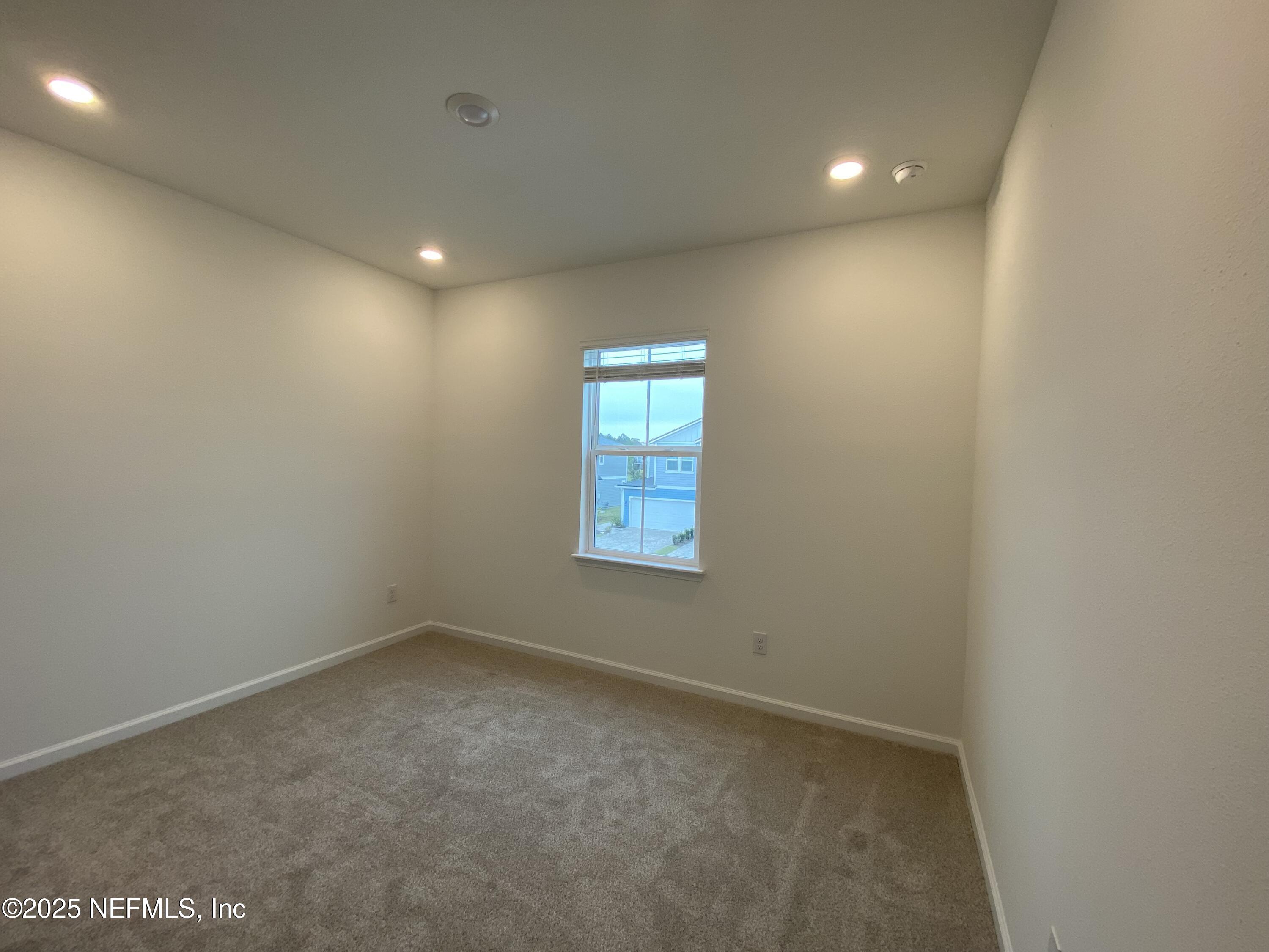 269 Brandon Lks Drive St. Augustine, FL 32092 - Photo 12 of 16 a view of an empty room with a window