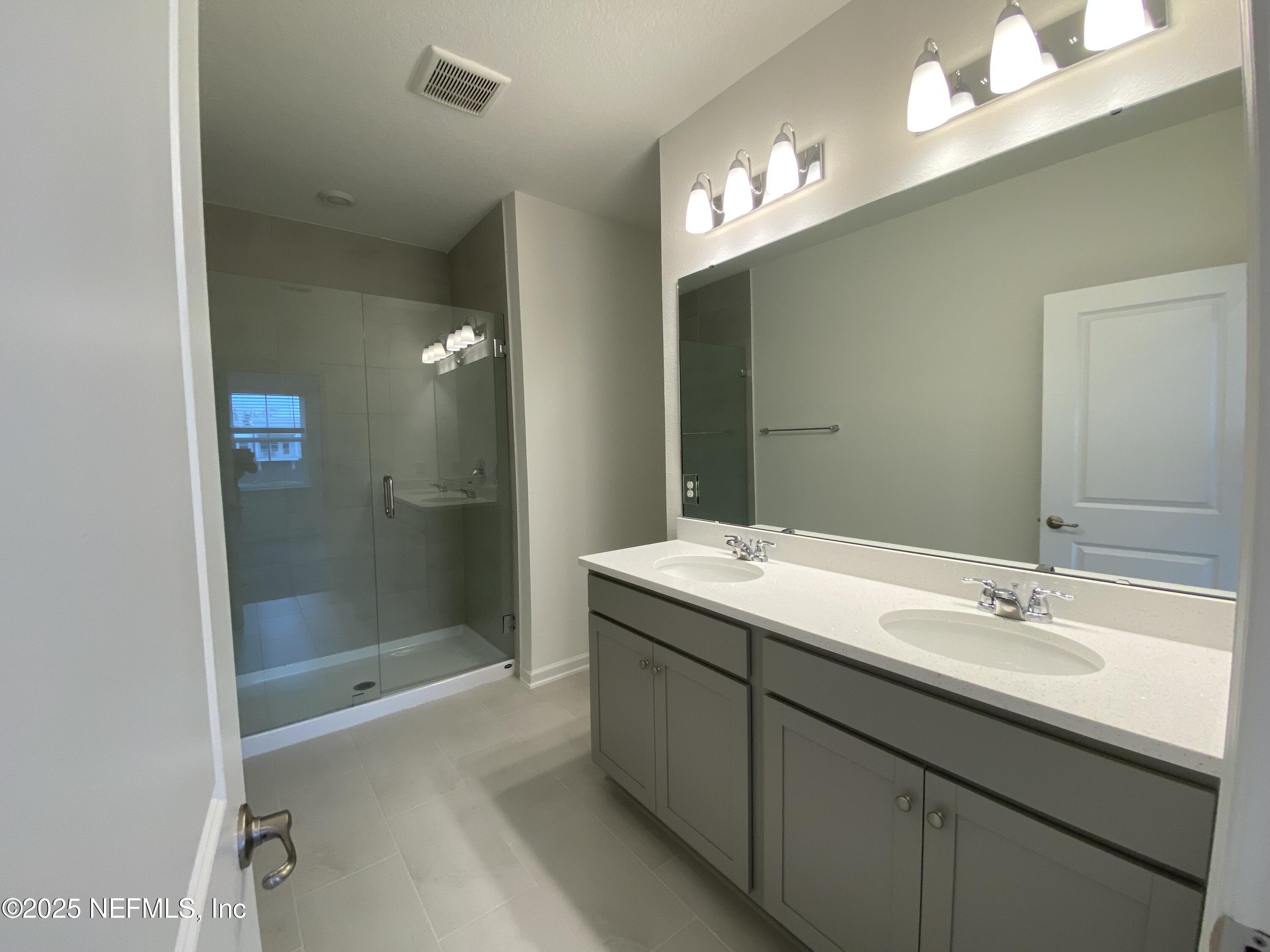 269 Brandon Lks Drive St. Augustine, FL 32092 - Photo 8 of 16 a bathroom with a sink double vanity and a mirror