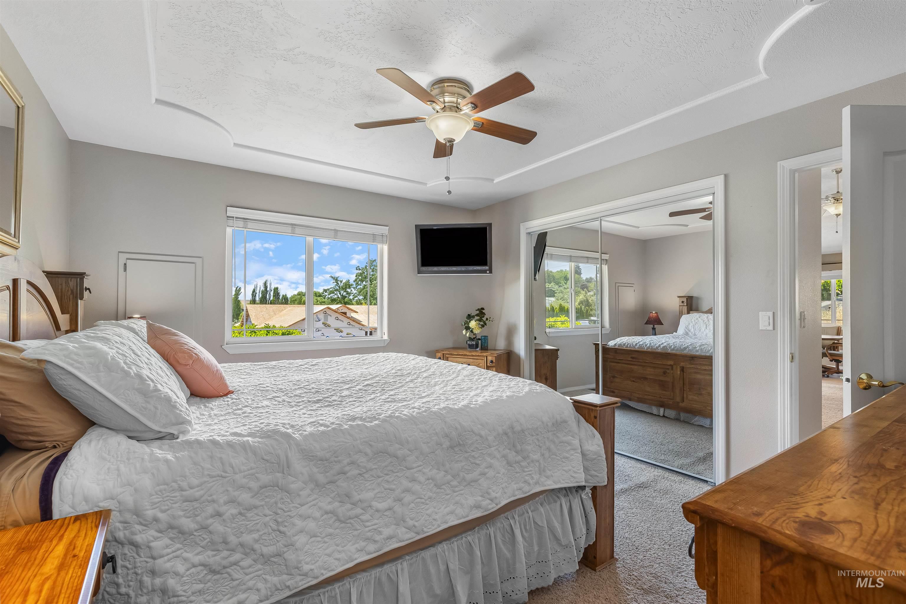 935 Grelle Avenue Lewiston, ID 83501 - Photo 23 of 33 Carpeted bedroom with a closet, ceiling fan, and a textured ceiling