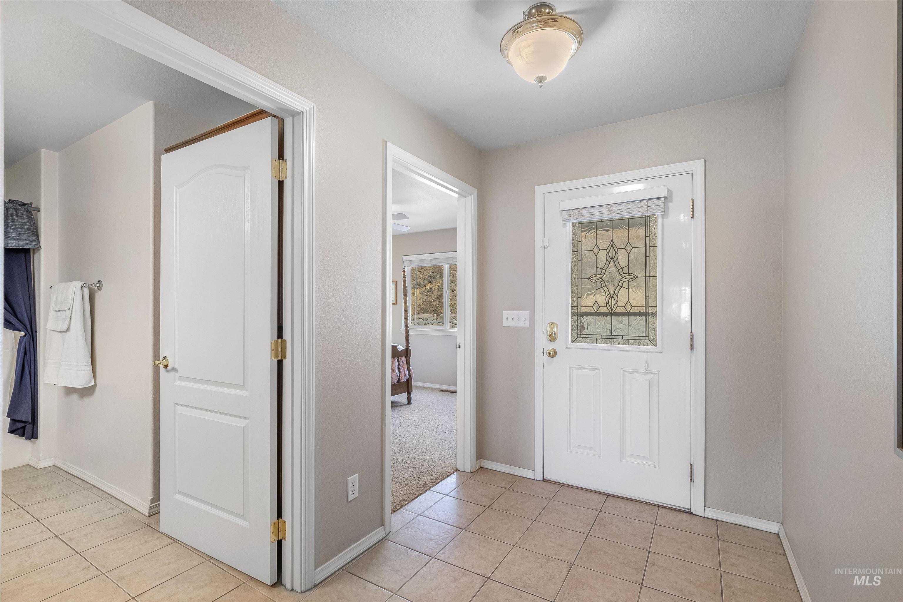 935 Grelle Avenue Lewiston, ID 83501 - Photo 7 of 33 Foyer featuring light tile patterned flooring and baseboards