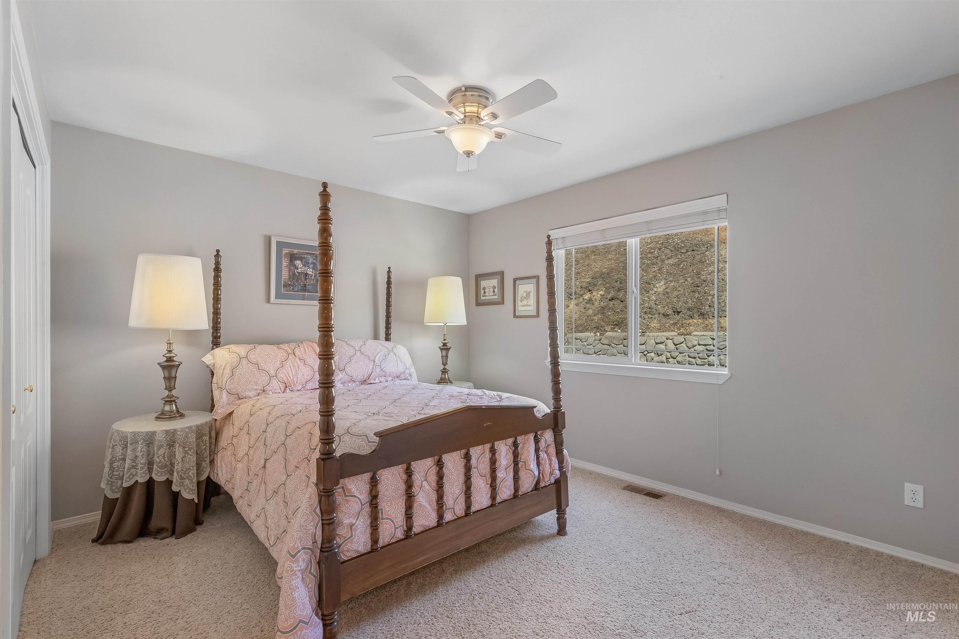 935 Grelle Avenue Lewiston, ID 83501 - Photo 8 of 33 Bedroom with carpet floors, ceiling fan, and a closet