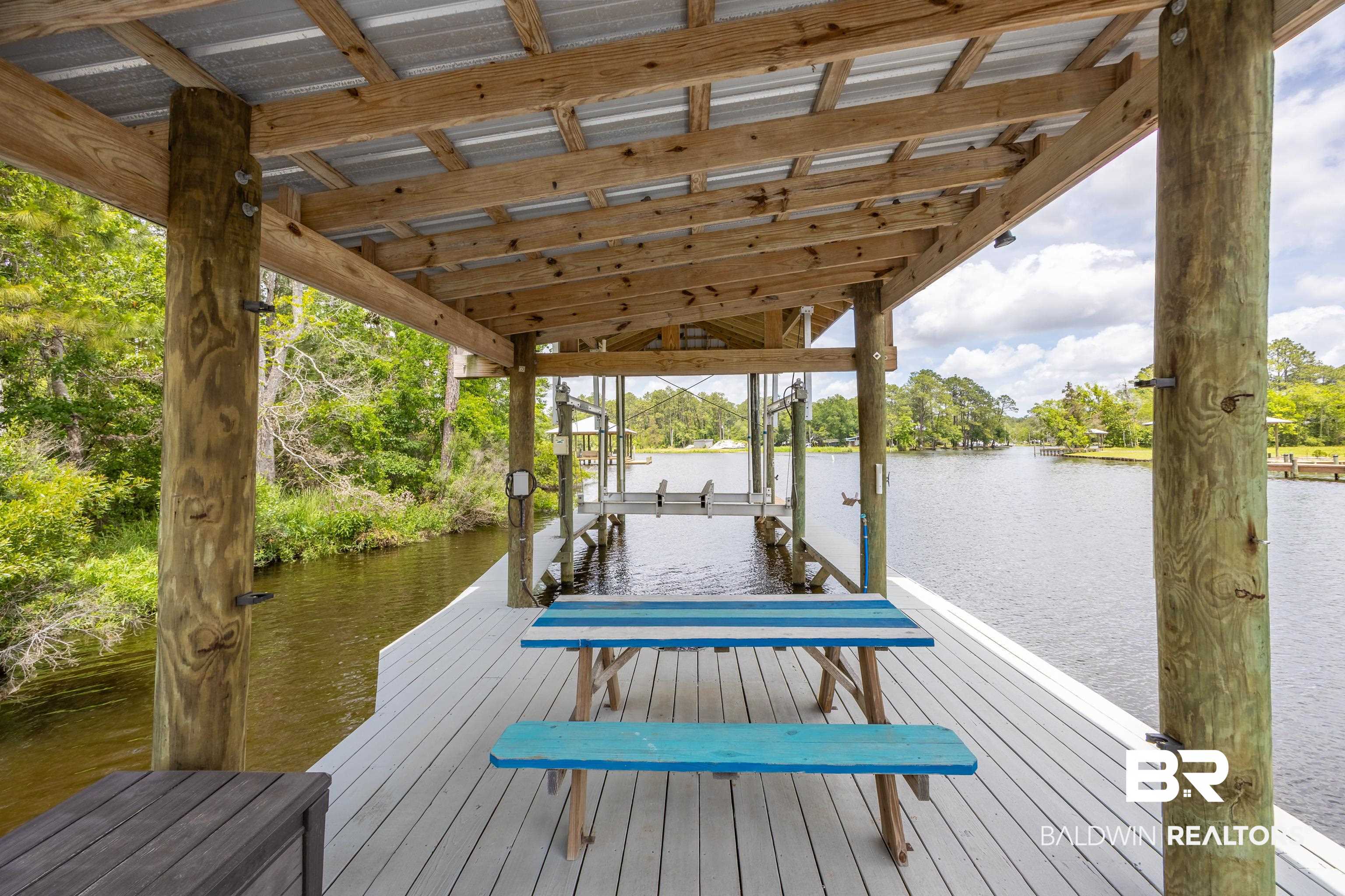 9771 Clarke Ridge Road Foley, AL 36535 - Photo 13 of 72 Dock area featuring a water view and boat lift.