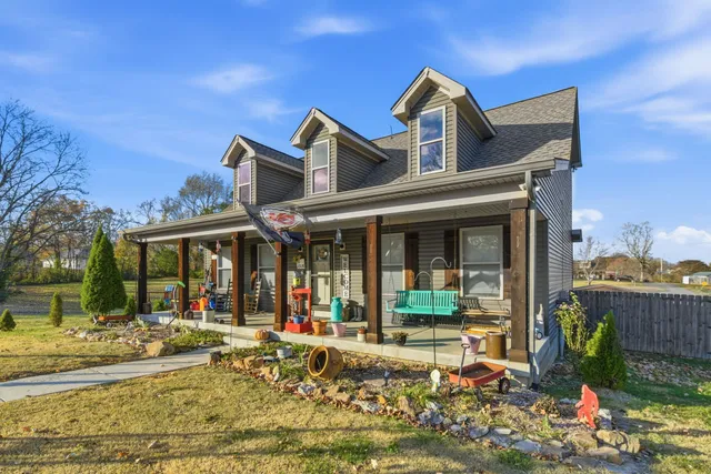 a view of a house with a yard balcony