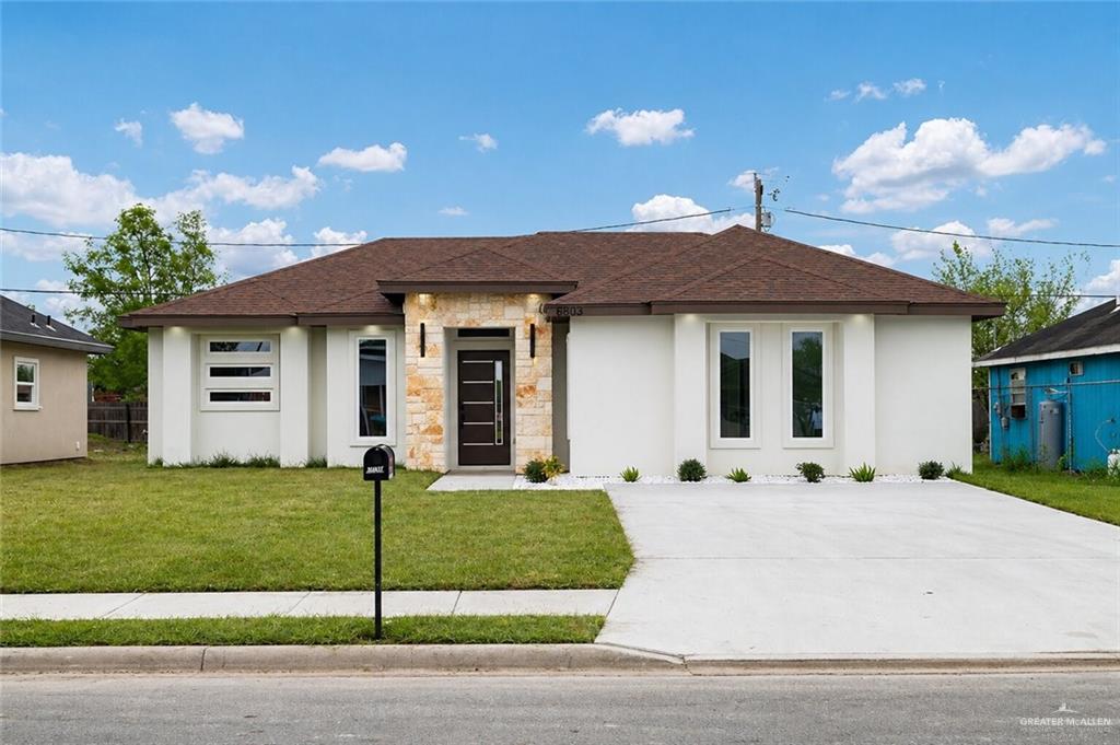 6803 South Azul Lane Pharr, TX 78577 - Photo 1 of 1 a front view of a house with a garden