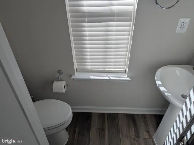 a bathroom with a toilet and a sink