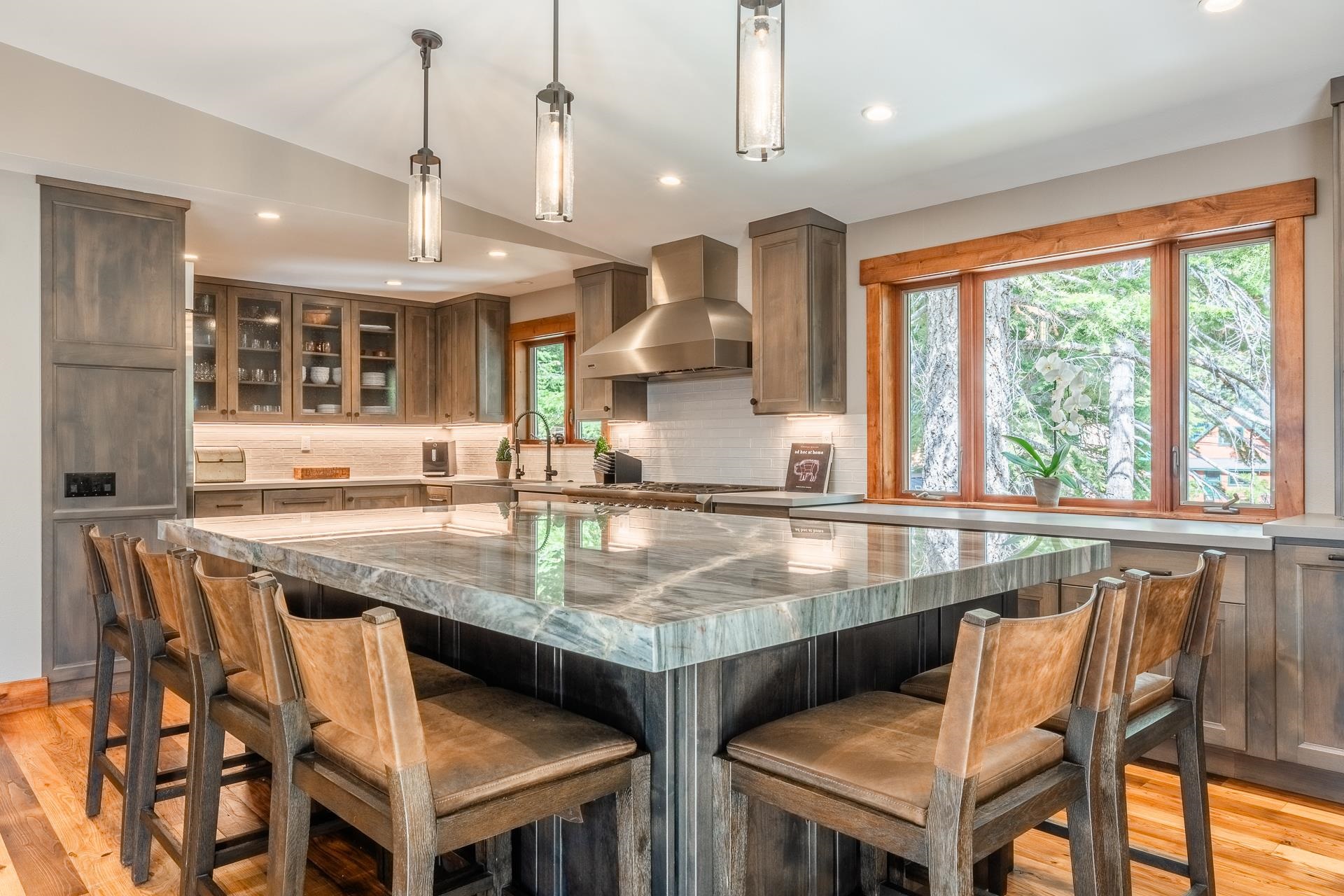 62 Cliff Circle Mammoth Lakes, CA 93546 - Photo 2 of 45 a dining table with chairs and kitchen view